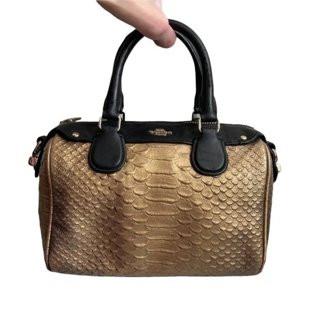 Coach gold embossed leather mini barrel bag